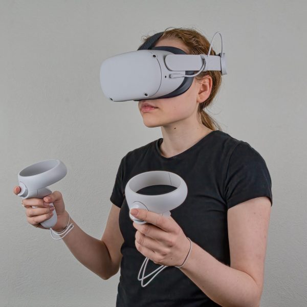 Young female wearing a VR headset Young female wearing a virtual reality headset